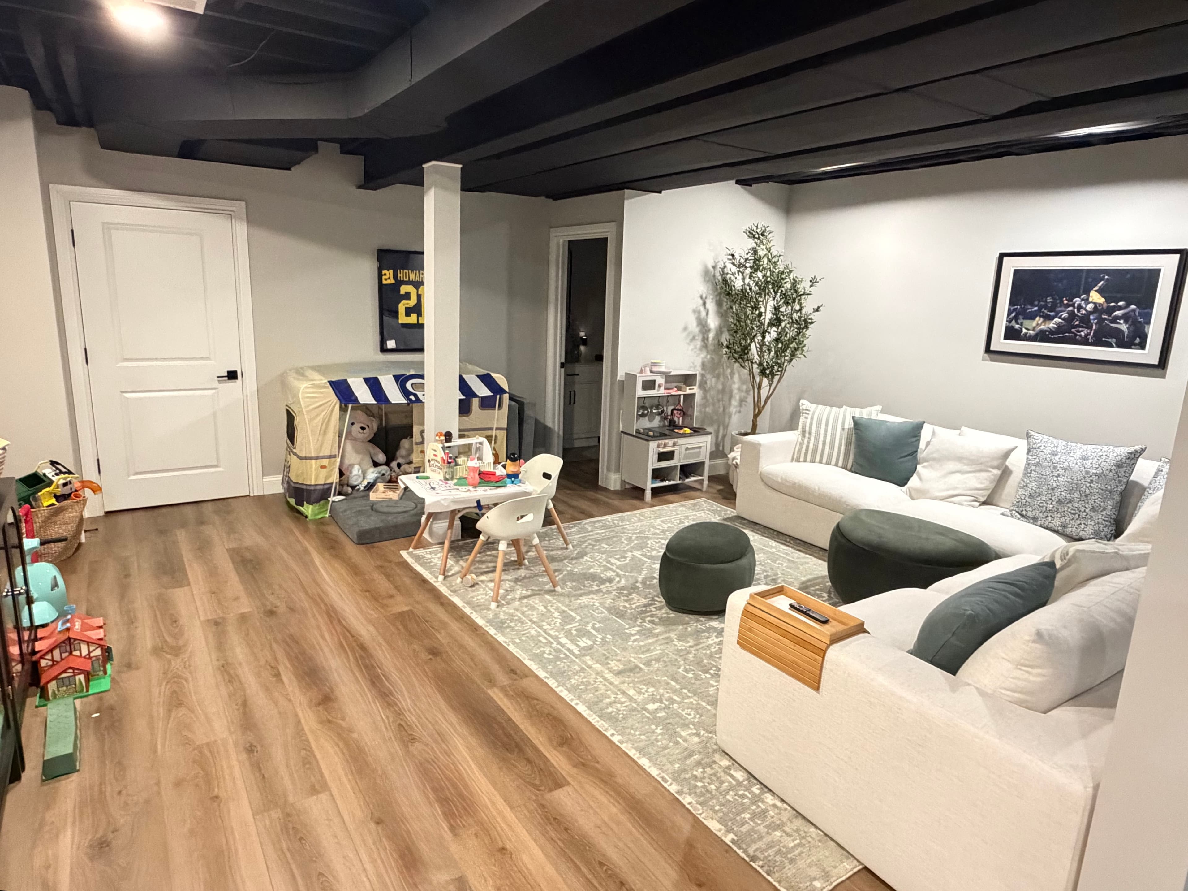 Finished basement family living area with sectional couch